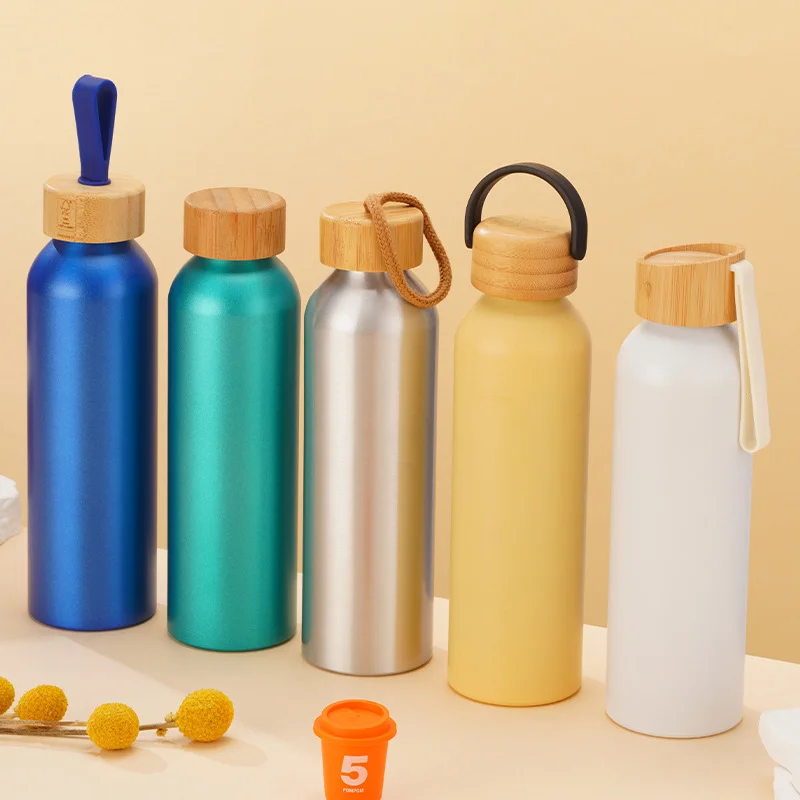 Custom 600ml aluminum water bottles in assorted colors with multiple bamboo lid styles